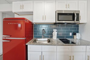 Fridge, microwave, oven, stovetop - Minimalist studio with modern design touches (Austin)
