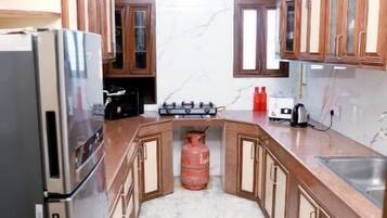 Apartment, Balcony, City View | Private kitchen | Dining tables