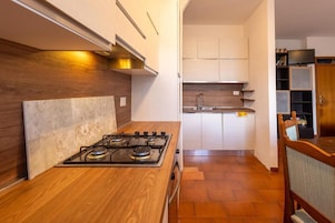 Apartment, Balcony | Private kitchen | Espresso maker, fridge, oven, electric kettle