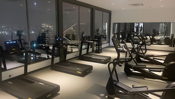 A modern gym with treadmills, exercise bikes, and free weights. - Enjoy Luxury living on a budget at the heart of Accra (Accra)