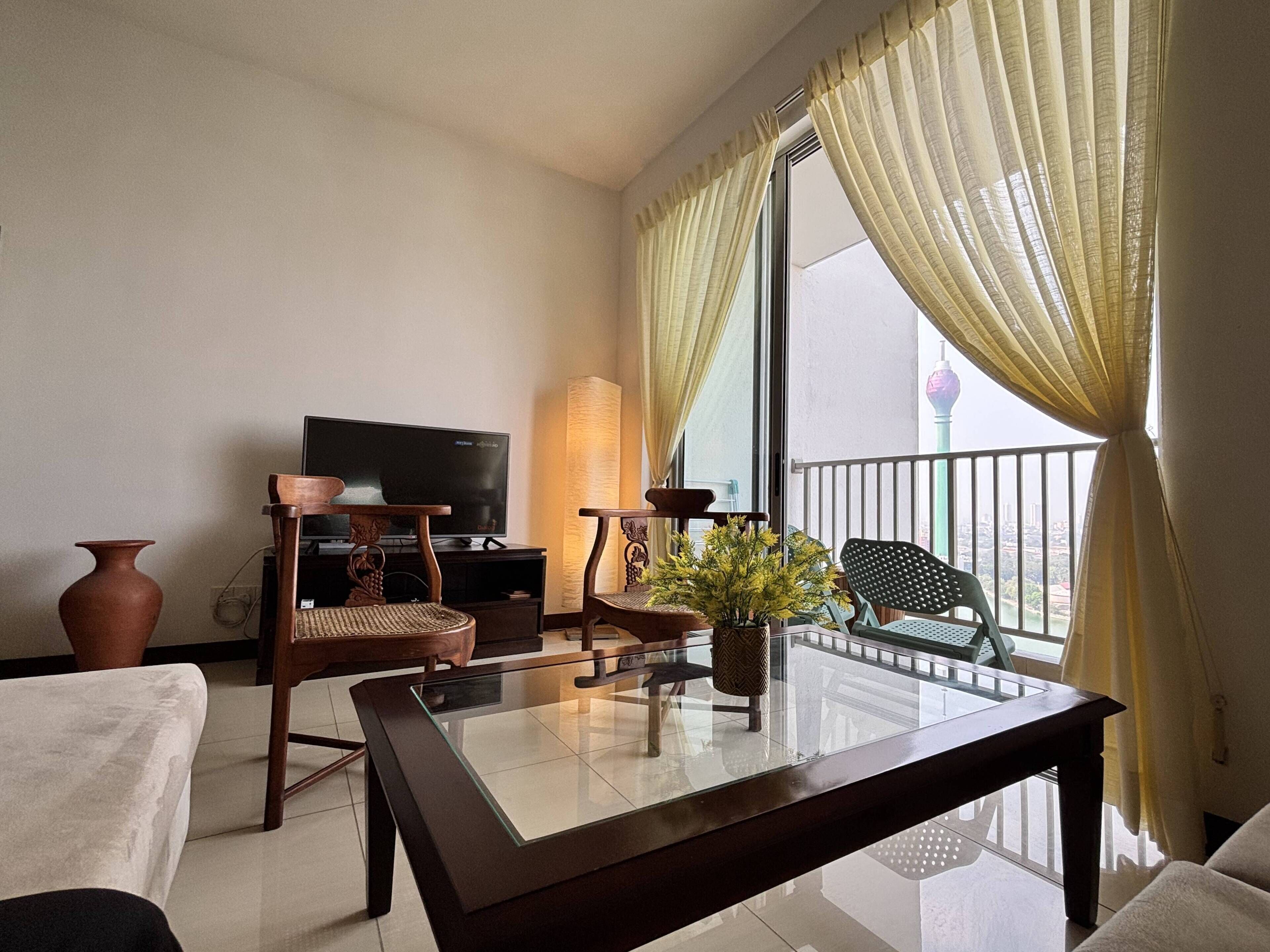 Departamento Deluxe, 2 habitaciones, vista parcial al océano, torre | Área de sala de estar