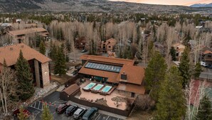 A hotel with a pool, surrounded by trees and mountains. - New Listing! Walkable Frisco Condo | Near Breck & Copper | Pool + Hot Tub (Frisco)