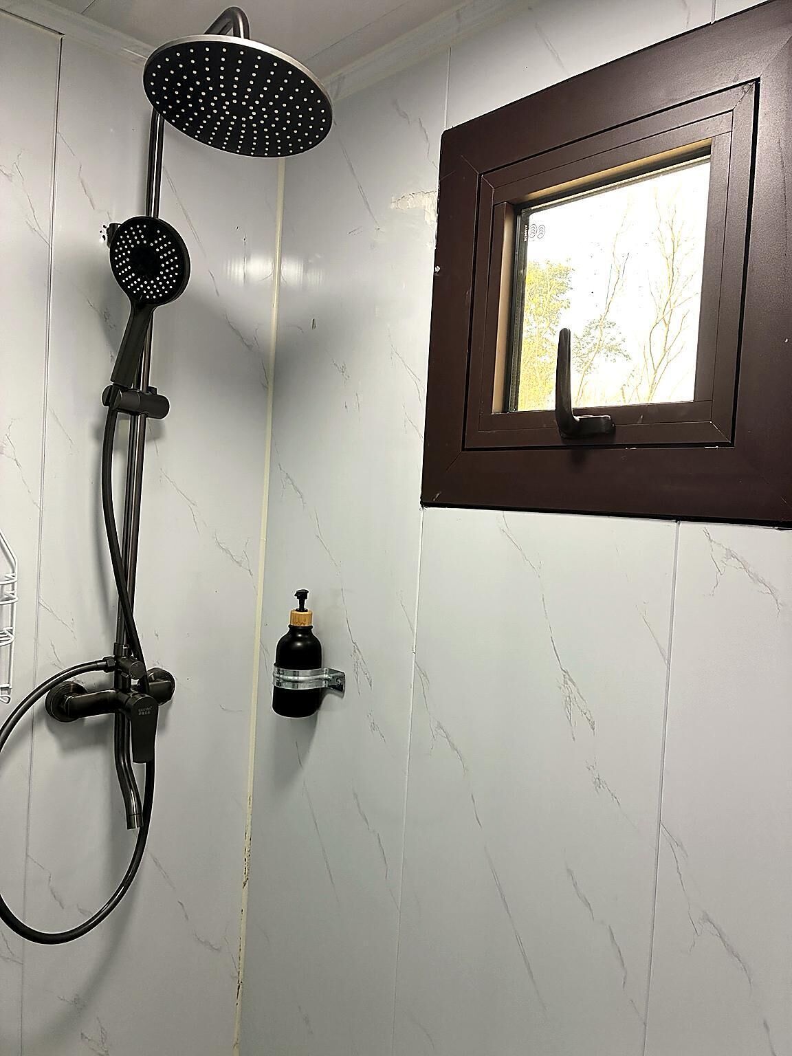 Shower, towels, soap, toilet paper