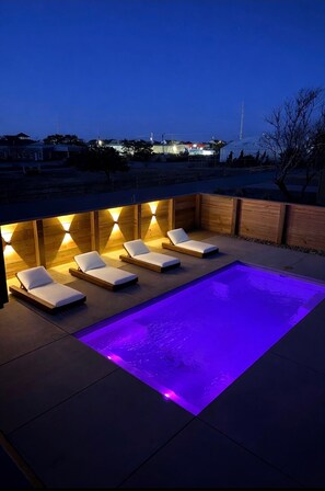 A heated pool - New Listing! Heated Pool, Hot Tub, Sauna, Soaker Tub, Outdoor Shower, King Bed! (Kitty Hawk)