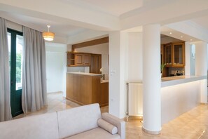 Superior Villa, Sea View | Living area | 65-inch Smart TV with cable channels, fireplace, video-game console - Lithea Seaview Villa & Estate (Chania)