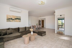 Superior Villa, Sea View | Living area | 65-inch Smart TV with cable channels, fireplace, video-game console - Lithea Seaview Villa & Estate (Chania)