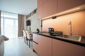 Fridge, microwave, stovetop, coffee/tea maker