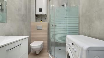 Shower, hair dryer, towels, shampoo