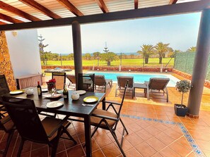 Outdoor dining - Luxury South-Facing 4-Bed Villa in Caleta| Frontline Golf | Panoramic 360° Views (Castillo Caleta de Fuste)