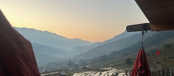 Traditional Hmong house in the heart of the rice fields
