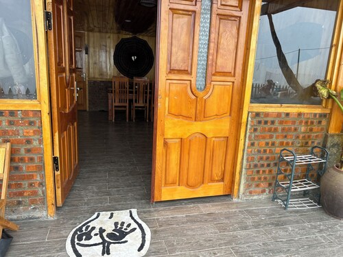 Traditional Hmong house in the heart of the rice fields