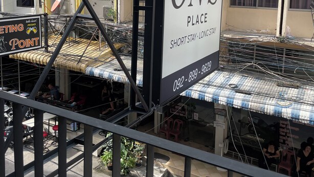 A building with a sign reading 'ON'S PLACE' and a contact number. - ON'S Place (Pattaya)