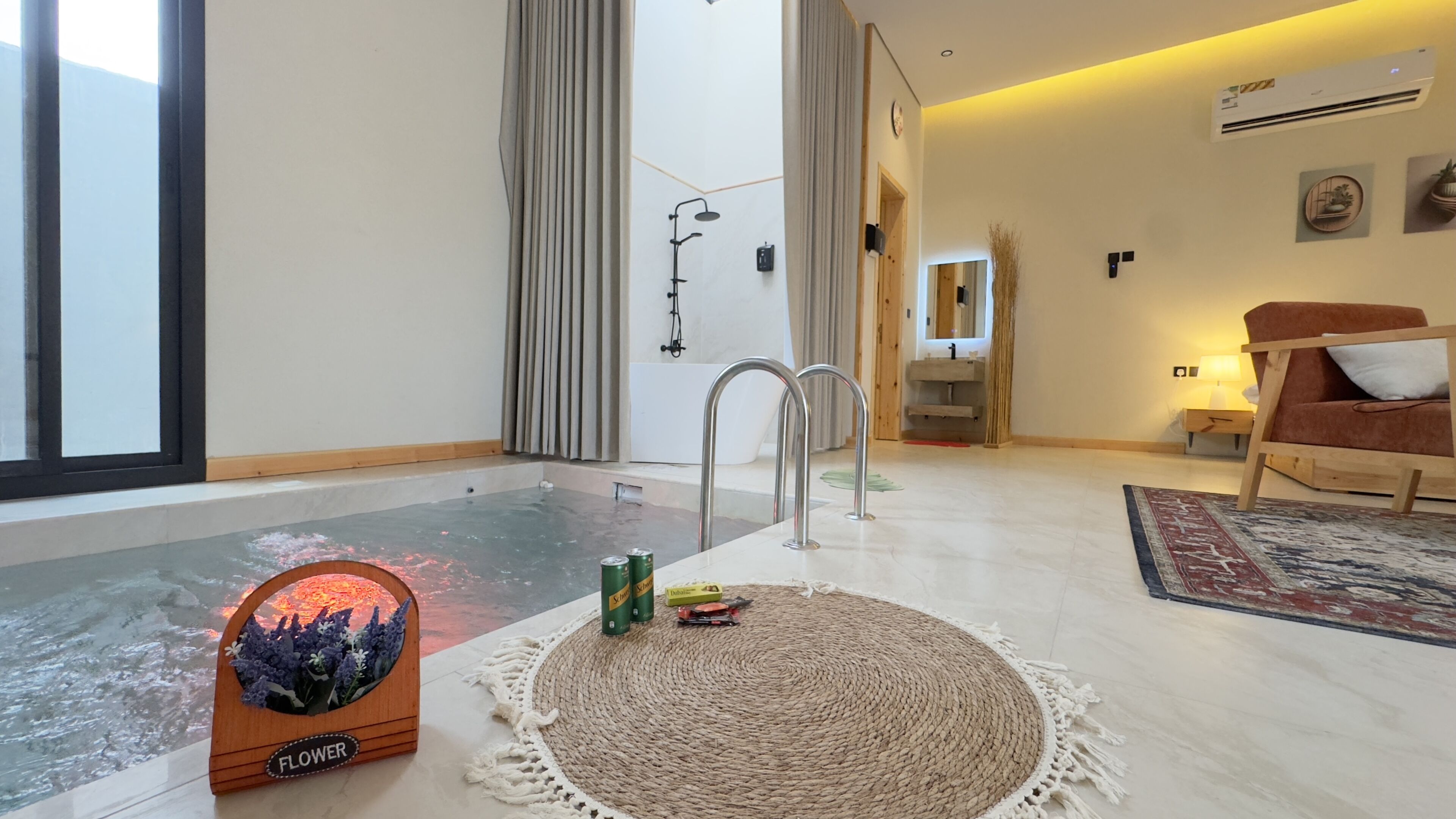 A modern bathroom with a bathtub, a shower, and a vanity.