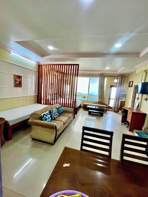 Family Studio Suite, Balcony, Mountain View | Living area | 24-inch LED TV with digital channels - Aizawl Guest House (Aizawl)