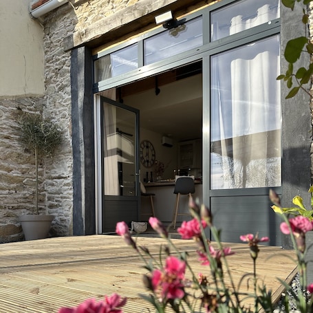 Outdoor dining. L'Envol - Jacuzzi - Sauna - View over Cherbourg