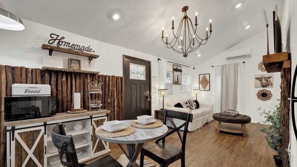 A kitchen with a 'Homemade' sign, a microwave, and a bread sign. - Poplar Place Soho - Cozy Cottage with Hot tub (Fredericksburg)