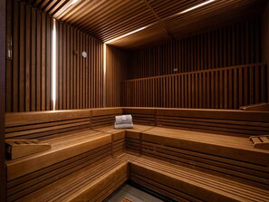 A sauna with wooden benches and slatted walls. - 4 Star Holiday Home in Travemunde (Lübeck)