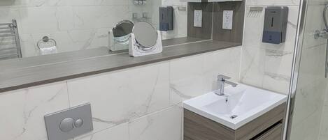 Shower, hair dryer, towels, soap