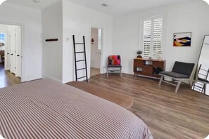A room with a bed, a desk, a chair, a ladder, and a window. - Simply Adventurous Too - Close to Everything Fun! (Mexico Beach)
