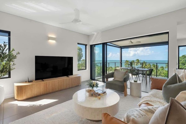 Relax into a light-filled living space where designer furnishings and uninterrupted ocean views set the tone.