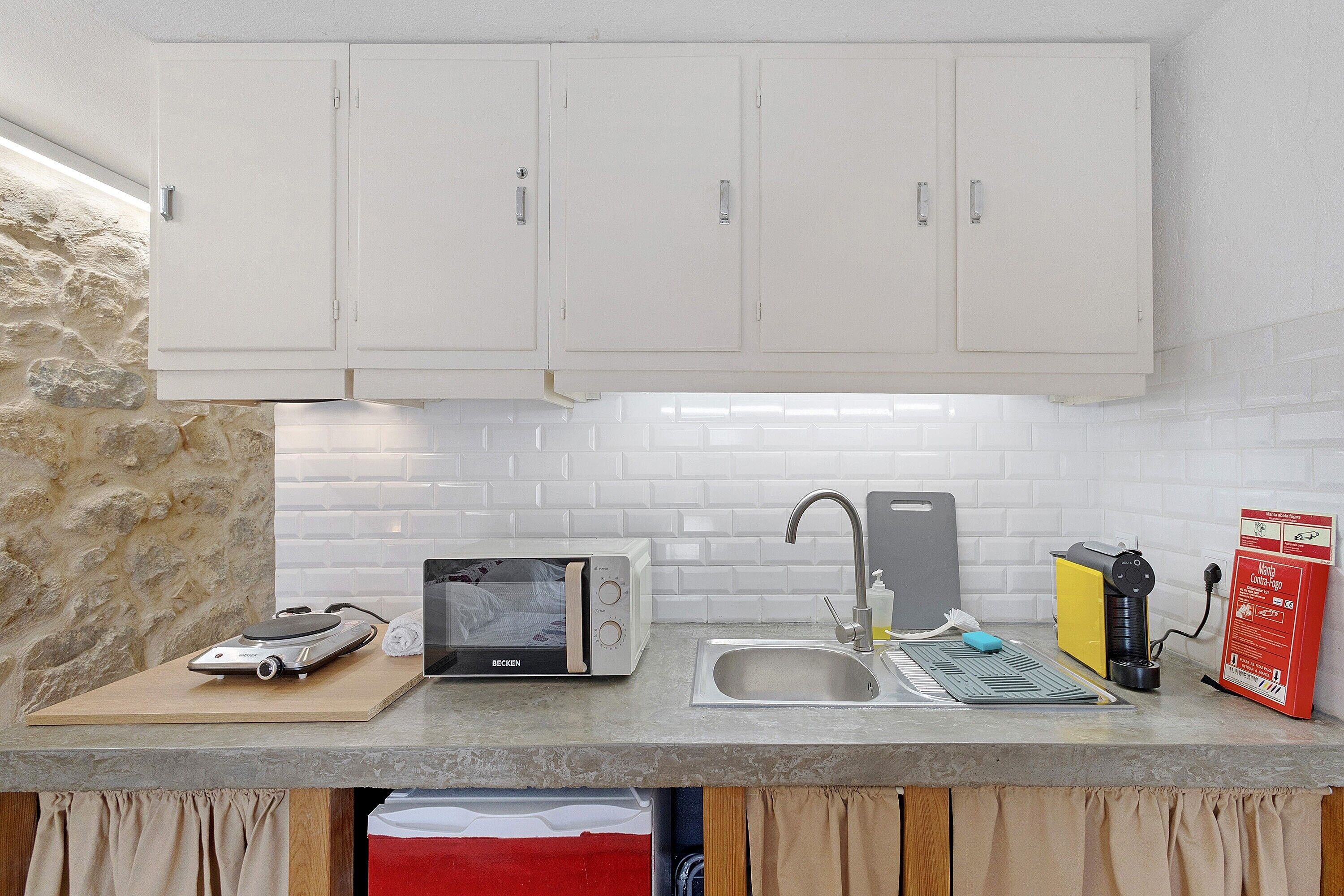 Fridge, microwave, stovetop, coffee/tea maker