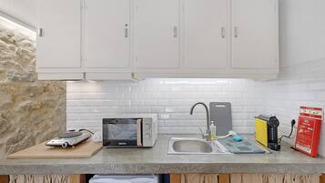Fridge, microwave, stovetop, coffee/tea maker