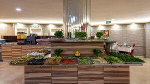 A buffet with various food items and a coffee station. - Dınar Hotel (Istanbul)