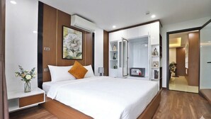 A modern bedroom with a bed, bedside table, and a nightstand. There is a wardrobe with a mirror and shelves. - Boho Apartment Tay Ho (Hanoi)