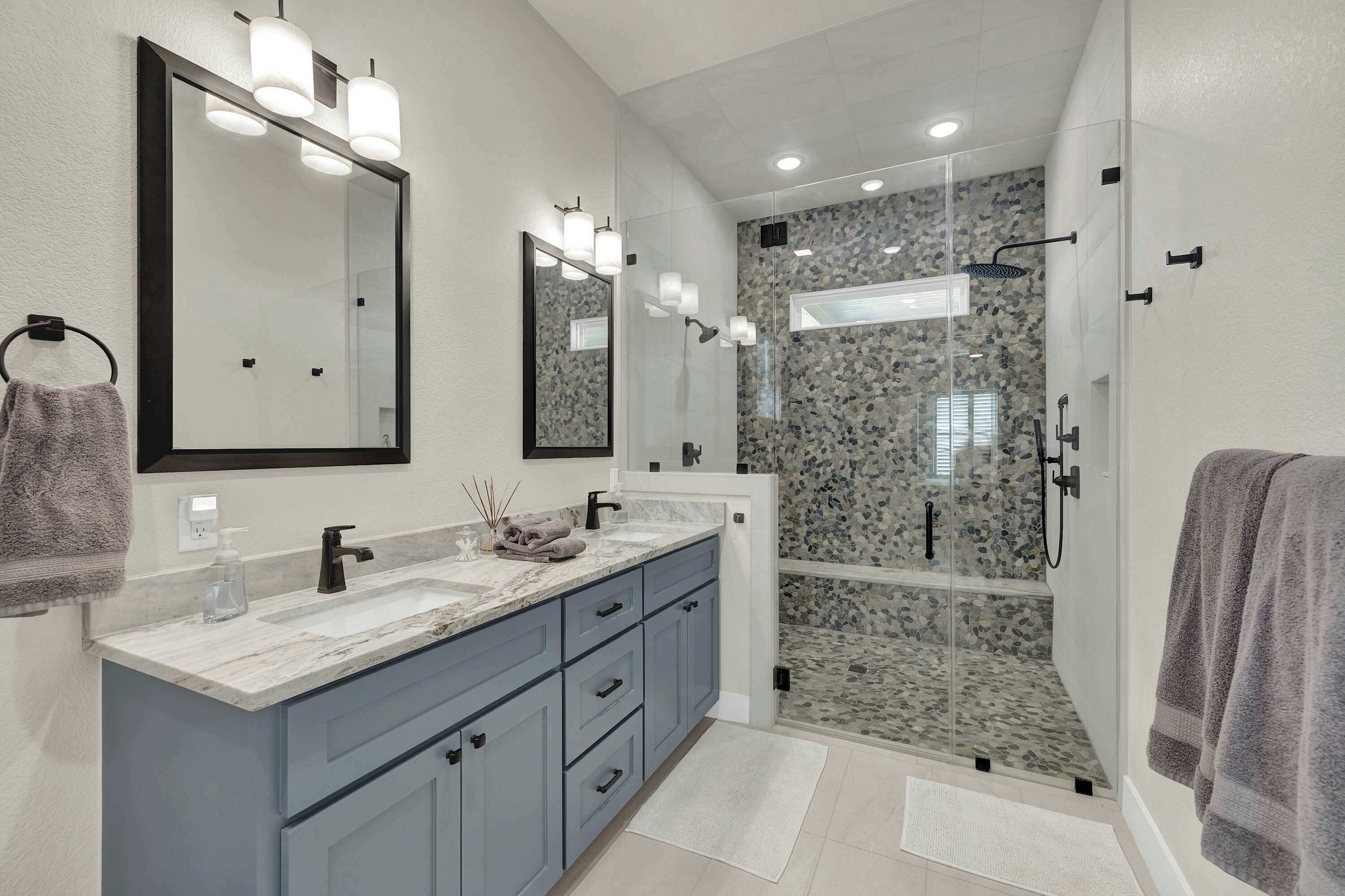 Shower, hair dryer, towels, shampoo