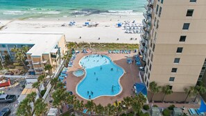 A hotel with a swimming pool, beach, and palm trees. - Tidewater 201•Remodeled•Beachfront•Pools&Hot Tubs •Beach Gear•Fitness Center (Panama City Beach)