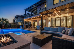 A modern outdoor living area with a pool, seating, and a fire feature. - Ocotillo Springs 53, Private Pool, Spa, Resort Amenities (Santa Clara)