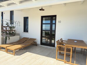 Deluxe Triple Room, Patio, Garden View | Outdoor dining