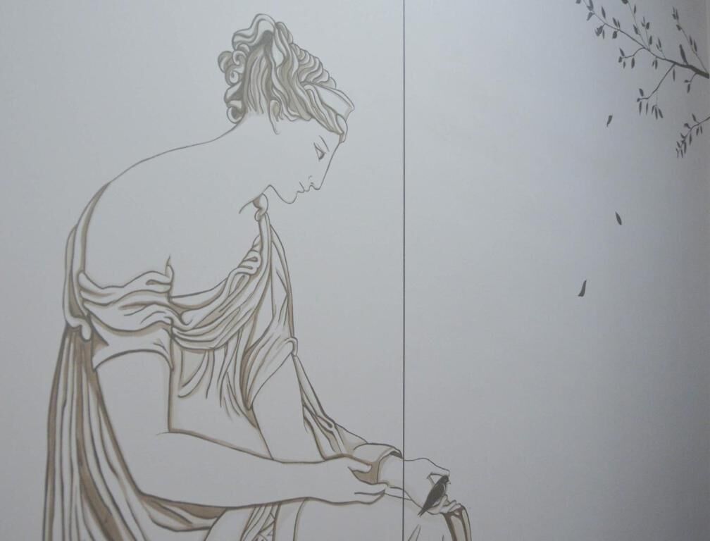 A sketch of a classical figure with flowing drapery, a branch with leaves, and a bird in flight.