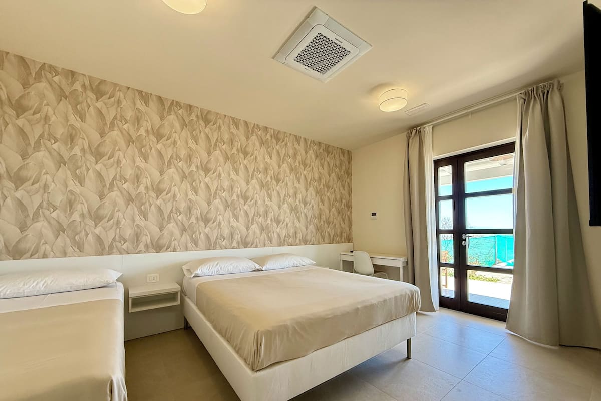 Deluxe Triple Room, Patio, Garden View