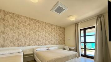 Deluxe Triple Room, Patio, Garden View