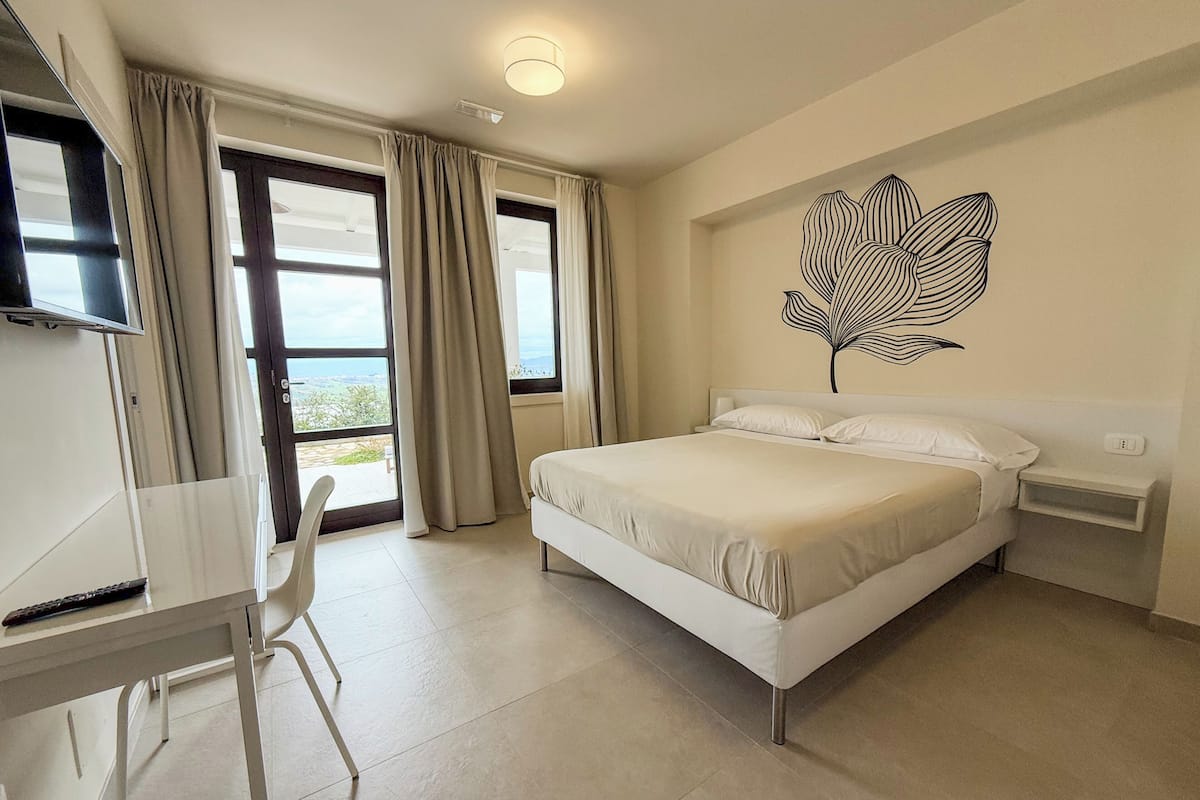 Deluxe Quadruple Room, Patio, Garden View