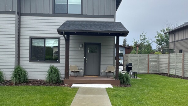 A two-story house with a covered porch, a front door, and a number '536' on the wall. - Beautiful home in the heart of Whitefish Montana (Whitefish)