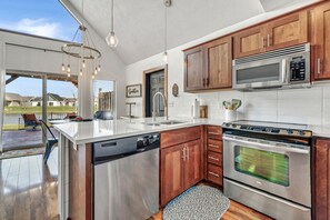Fridge, microwave, oven, stovetop - Welcome to Arnolds Park—a beautifully designed vacation cabin located in Bridges Bay Resort (Arnolds Park)
