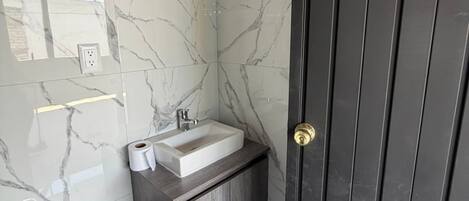 Shower, jetted tub, towels, soap