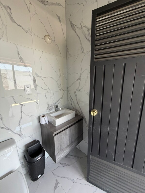 Shower, jetted bath, towels, soap