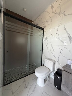 Shower, jetted bath, towels, soap