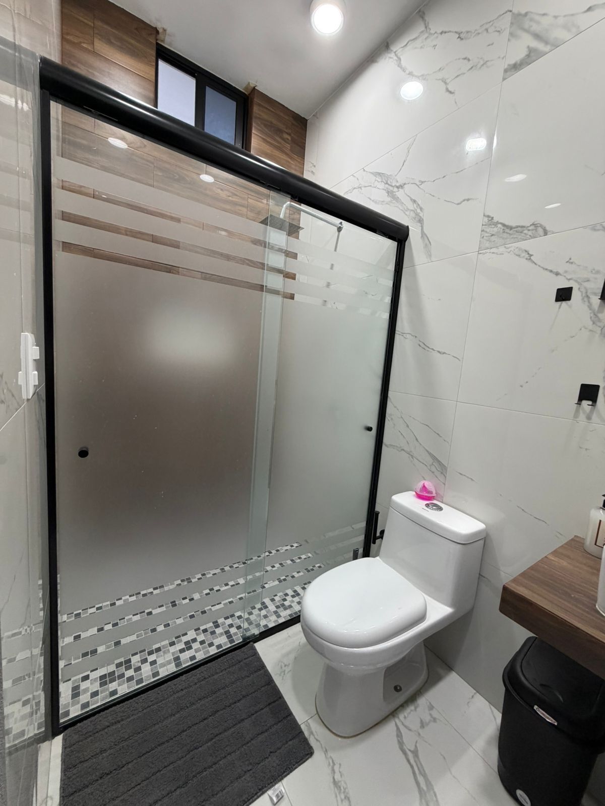 Shower, jetted bath, towels, soap