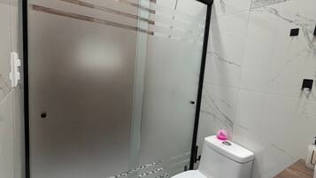 Shower, jetted bath, towels, soap