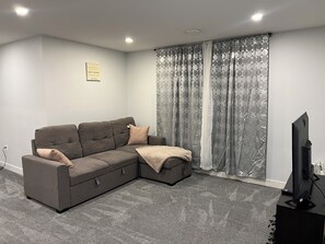 Living area - Hidden Gem 💎 Stylish Suite w/ All-Inclusive Comfort” (Regina)