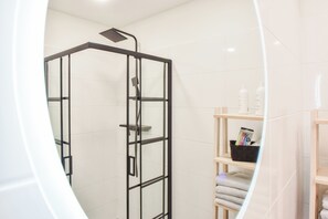 Shower, hair dryer, towels, soap