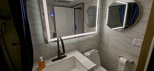 Shower, hair dryer, towels, soap