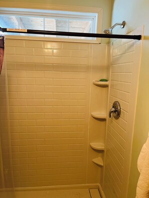 Shower, hair dryer, towels, toilet paper