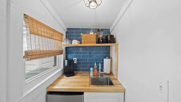Microwave, coffee/tea maker, toaster, cookware/dishes/utensils