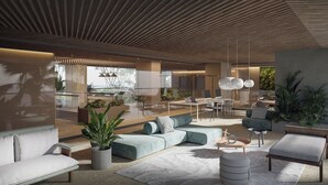 A modern interior with a dining area, seating, and plants. - Nuruma Suites by Avia Suites (Santa Marta)