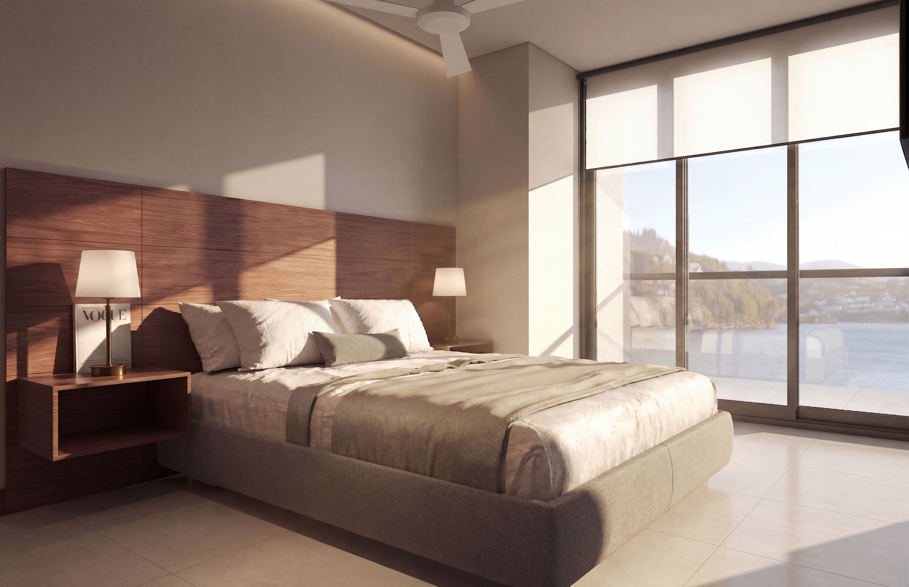 A modern bedroom with a large bed, nightstands, and a view of a body of water through large windows.